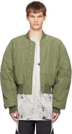 Padded polyester twill bomber jacket. Eyelets throughout. · Paneled construction · Rib knit stand collar, hem, and cuffs · Two-way zip closure · Flap pockets · Full taffeta lining Available exclusively at SSENSE. Supplier color: Khaki Modern Spring Outerwear With Zip Cuffs, Modern Outerwear With Ribbed Cuffs For Spring, Modern Spring Outerwear With Ribbed Cuffs, Urban Outerwear With Zip Cuffs For Spring, Spring Streetwear Outerwear With Zip Cuffs, Heliot Emil, Mens Outerwear, Color Khaki, Flap Pocket