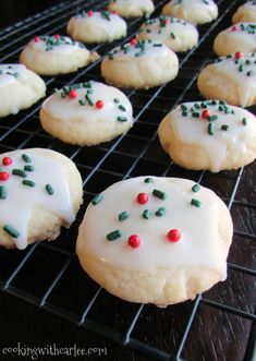 frosted cookies with sprinkles on a cooling rack