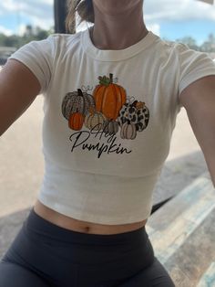 Hey Pumpkin crop top and baby tee. Women's Pumpkin crop top for fall. Lightweight and breezy! Fitted Casual Cropped T-shirt For Fall, Fitted Crop Top T-shirt For Fall, Fitted Crew Neck Cropped T-shirt For Fall, Fitted Cropped T-shirt Crew Neck For Fall, Fitted Cropped T-shirt For Fall, Trendy Fall Crop Top T-shirt, Trendy Orange Crop Top For Fall, Trendy Crop Top T-shirt For Fall, Casual Orange Crop Top For Fall