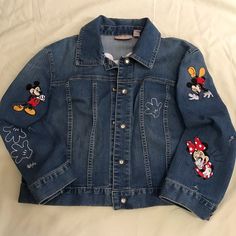 Chico’s; Mickey & Minnie Jean Jacket- Never Worn The Embroidery Was Just Added With A Few Mouse Holes Added And You Can Add Your Own. Glass Shiny Buttons With Medal Finish. This Is A Fun Jacket For Anyone Who ’S Mickey!! One Of A Kind Item, Not Sold In Stores And The Mouse Hole Are Free. Lol !! Chico’s Size 2 (8/10- M) Price Firm!! - Free Shipping!! Whose Going To Disney !! Go With Styling M&M Best Team Ever, Rocking It !! Embroidered Long Sleeve Outerwear For Fall, Blue Long Sleeve Outerwear With Embroidered Patch, Denim Long Sleeve Outerwear With Embroidered Patch, Blue Outerwear With Embroidered Patch For Fall, Blue Winter Outerwear With Embroidered Patch, Embroidered Long Sleeve Denim Jacket For Fall, Casual Long Sleeve Outerwear With Machine Embroidery, Blue Embroidered Winter Outerwear, Fall Blue Outerwear With Embroidered Patch