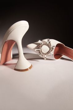 BEGUM MULE - Amina Muaddi - Official Site Amina Muaddi Bridal Shoes, Amina Muaddi White Heels, Luxury White Mules With Sculpted Heel, White Luxury Formal Mules, Designer White Leather Mules, Luxury White Mules For Evening, Luxury White Evening Mules, Designer White Formal Mules, Designer White Pointed Toe Mules