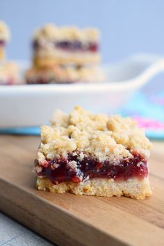 a piece of cake sitting on top of a wooden cutting board