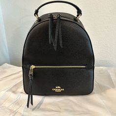 Never Used - Coach Jordyn Backpack - Black - Gold Hardware Coach Backpack Jordyn, Black Backpack With Gold-tone Hardware For Daily Use, Modern Backpack With Gold-tone Hardware, Black Backpack With Gold-tone Hardware, Black Backpack With Gold-tone Hardware For Travel, Black Backpack With Gold-tone Hardware For On-the-go, Black Standard Backpack With Gold-tone Hardware, Coach Black School Backpack, Black Coach Backpack With Removable Pouch