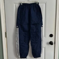 Men’s Navy Pants With Adidas Logo And Stripes On Outside Of Both Legs. Nwot Adidas Sports Pants With Pockets, Adidas Blue Streetwear Pants, Blue Adidas Streetwear Pants, Adidas Sports Bottoms With Side Pockets, Adidas Trousers With Pockets, Adidas Blue Sweatpants With Pockets, Blue Adidas Sweatpants With Pockets, Blue Adidas Bottoms With Pockets, Navy Adidas Sporty Pants