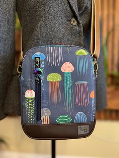 "This adorable convertible bag can be worn as a sling or a crossbody. The removable strap is 1.5 inch wide for comfort and is adjustable to about 60\". If this is too long for you, I can shorten it before shipping. Approximate size of bag is: 7\" long x 9\" high x 2.5\" wide at base" On-the-go Crossbody Camera Bag With Cell Phone Pocket, Versatile Adjustable Shoulder Bag For On-the-go, Versatile Everyday Crossbody Camera Bag, Casual Crossbody Camera Bag With Cell Phone Pocket, Casual Crossbody Camera Bag With Zipper Closure, Casual Crossbody Camera Bag For Everyday Use, Casual Rectangular Camera Bag With Detachable Strap, Casual Rectangular Camera Bag With Adjustable Strap, Adjustable Crossbody Bags For On-the-go