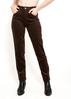 "Take a risk and elevate your wardrobe with Escada Choc Brn Corduroy Pants. Featuring a high waist and flattering fit in a rich chocolate brown color, these pants are both daring and stylish. Perfect for those who want to stand out and make a statement! Condition: Excellent Vintage Condition Material: Corduroy Closure: Gold button and zipper Details: High waisted, gold button   Length: long Care Instructions: Dry clean only Measurements: Original Tag Size: 34 Length: 40\" Waist: 26\" Hips: 36\" High Rise Brown Pants For Fall, Brown Mid-rise Corduroy Pants, Mid-rise Brown Corduroy Pants, High Rise Brown Bottoms For Winter, Fitted Brown Corduroy Pants, Chocolate Brown Colour, Take Risks, Zipper Detail, Gold Buttons