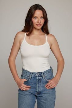 The perfect white tank Everyday Tank Top With Built-in Bra And Scoop Neck, White Scoop Neck Tank Top With Built-in Bra, White Tank Top With Built-in Bra For Layering, Spring Seamless Tank Top For Everyday, White Scoop Neck Tank Top For Layering, Everyday Scoop Neck Tank Top, Bra Friendly, Summer Tank Top With Built-in Bra, Spring Tank Top With Bra Friendly Wide Straps, Everyday Scoop Neck Tank Top With Built-in Bra