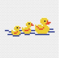 two yellow ducks are in the water with blue and red dots on them, one is holding