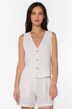 This Dellis Vest features a button-up design, a v-neckline, and front seam detailing. Made with high-quality materials, this vest offers both style and comfort. Material: 100% Linen Machine wash Color: White Model is 5'9" and wearing a size S Imported Linen Vest, White Vest, Heart Clothes, Jumpsuits And Romper, Vest White, New Tops, New Arrival Dress, Jacket Sale, Sweater Jacket