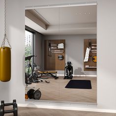 an exercise room with mirrors and gym equipment