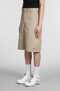 Shorts in khaki cotton, concealed front fastening, four pockets, waist belt loops, slim fit, 65% polyester 35% cottone, Model is 1. 83 and wears size 31 | Dickies Men's Shorts in Khaki Cotton | SS23 Khaki Bottoms With Built-in Shorts And Relaxed Fit, Cotton Shorts With Belt Loops, Fitted Cotton Cargo Shorts With Pockets, Fitted Cotton Shorts With Pockets, Fitted Cotton Shorts With Side Pockets, Casual Khaki Shorts With Belt Loops, Summer Cotton Bermuda Shorts With Belt Loops, Khaki Workwear Shorts With Side Pockets, Khaki Relaxed Fit Shorts