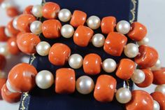 -Vintage 14k Gold Faceted Natural Momo Coral with Pearl Beaded Necklace -Total length: 22.5 in -Smallest coral size: 7 mm x 5.5 mm -Biggest coral size: 11.85 mm x 8.4 mm -Pearl size: 5.5 mm ~ 7.25 mm -Total weight: 49.8 g -Marked 14k Elegant Orange Hand-strung Necklace, Vintage Orange Beaded Necklaces For Formal Occasions, Formal Orange Single Strand Necklace, Classic Orange Necklace For Formal Occasions, Classic Orange Necklaces For Formal Occasions, Orange Classic Formal Necklaces, Orange Classic Formal Necklace, Pearl Beaded Necklace, Coral Earrings