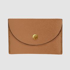 Crafted from our luxurious, textured Recycled Saffiano Leather (outer) and Cotton Twill lining (interior), the Essential Business Card Holder is a classic business card holder in a timeless pouch style, featuring a reliable snap button closure in gold tde. hardware. Specifically designed to comfortably fit standard-sized business and credit cards, the Essential Business Card Holder will keep your cards organised and easily accessible. Dimensions: 7.5cm (H) x 10.5cm (W) x 2cm (D) Pictured here: O Classic Business Card, Card Organizer, Recycled Leather, Free Gift Wrapping, Business Card Holders, Business Cards, Card Holder, Recycling