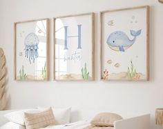 two framed pictures hang above a bed in a child's room