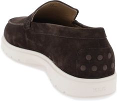 Step into luxurious comfort with these suede slipper moccasins. Made of rich suede leather with Tod's monogram embossed on the front, these casual yet stylish moccasins are the perfect addition to your wardrobe. Featuring a rubber sole with grooves and embossed rubber grommets, they are made in Italy and showcase exposed hand stitching for added quality. Made of rich suede leather Embossed Tod's monogram Rubber sole with grooves and embossed grommets Exposed hand stitching Designed and made in I Suede Slippers, Versace Bags, Prada Designer, Balenciaga Designer, Suede Loafers, Hermes Bags, Lv Bag, Fendi Bags, Leather Interior