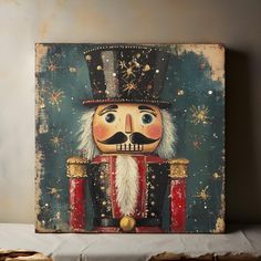 a painting of a nutcracker is displayed on a shelf