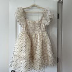 Size S Sweet Party Dress With Ruffle Hem, Cute Flowy Party Dress, Sweet Short Sleeve Party Mini Dress, Cute Cream Mini Dress With Ruffles, Cute A-line Mini Dress With Ruffles, Cute Polka Dot Dress With Ruffles, Flowy Polka Dot Dresses With Ruffles, Party Mini Dress With Swiss Dot Pattern, Party Mini Dress In Polka Dot