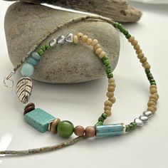 "This handmade necklace consists of earthy turquoise, sterling silver, wood and ceramic. A beautiful one of a kind creation.   . The length of the necklace hangs approx 52cm (21\") and has silver sterling lobster clasp and ring at the back. If you have any questions about this item, don't hesitate to contact me. To return to my shop click here http://www.etsy.com/shop/earlybirdcreations" Turquoise Beaded Necklace With Nature-inspired Style, Turquoise Beaded Nature-inspired Necklace, Earthy Turquoise Beaded Necklaces With Round Beads, Earthy Turquoise Necklaces For Jewelry Making, Handmade Turquoise Beaded Necklaces Nature-inspired, Handmade Turquoise Beaded Necklace Nature-inspired, Handmade Turquoise Beaded Necklace, Nature-inspired, Earthy Turquoise Gemstone Beaded Necklaces, Earthy Green Necklace With Wooden Beads