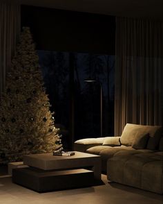 a living room filled with furniture and a christmas tree in front of a large window