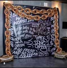 a large blackboard with chains attached to it