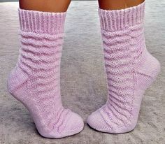 the legs of a woman wearing pink socks