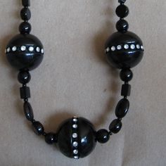 This necklace is about 23" long and is made of a Large Black Resin Beads with Rhinestones on a necklace of varied-shaped black beads.  It is lots of fun! The lage beads is about 1".  After many happy years I am closing my jewelry business and all items are 50% off retail. Please see my other items.  Enjoy!  (24-N1037) Black Resin, Happy Year, A Necklace, Resin Beads, Pittsburgh Pa, Jewelry Business, Black Beads, Large Black, Pittsburgh