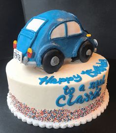 a birthday cake with a blue car on top