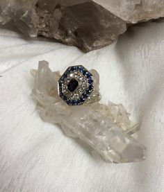 "This is a gorgeous custom made vintage Natural Sapphire ring. The center sapphire is radiant cut. There are 24 diamonds surrounding and framing the sides of this fabulous ring that total 1/2 carats. There are 20 brilliant cut sapphires framing the top of this octagon shape ring which measures 7/16\" X 7/16\". This vintage ring is custom made in 14k white gold and weighs 7.9 grams. It has a superfit shank that opens to fit over your knuckles and is a size 5. The retail value of the superfit open 45th Anniversary, Sterling Silver Rings Turquoise, Octagon Shape, Turquoise Ring Silver, Black Hills Gold, Star Sapphire, Wedding Rings Vintage, Radiant Cut, Pink Ring