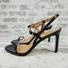 New Fabric: Croc-Embossed Faux Leather Open Toe Padded Foot Bed Buckle Ankle Strap Rubber Sole Imported, China This Item Cannot Be Gift-Boxed Style #Samed42306 Sophisticated, Versatile Style Is The Name Of The Game With These Sam Edelman Sandals, Which Feature A Simple Strappy Upper In Croc-Embossed Leather. Black Sandals With Pointed Toe And Strap, Black Slingback Sandals With Buckle For Party, Black Slingback Sandals With Buckle Closure For Party, Leather Strappy Sandals For Date Night, Party Sandals With Adjustable Strap And Round Toe, Leather Strappy High Heel Sandals, Chic Sandals With Straps And Round Toe, Faux Leather Ankle Strap Sandals, Leather Open Toe Heels With Straps