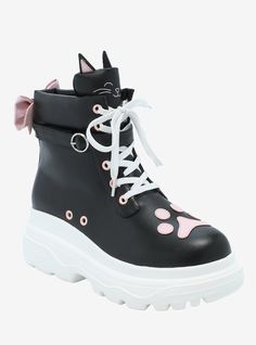 Step out in the most purr-fect pair of hi-tops right meow! These kawaii sneakers have a black faux leather body with a pink paw at the toe and a pink bow on the back. A black cat is depicted on the tongue complete with 3D ears.Polyurethane top; rubber soleImported Black Kawaii Outfits, Shoe References, Kawaii Sneakers, Cat Outfit, Goth Kawaii, Pastel Goth Outfits, Alt Clothes, Pink Paws, Cat Shoes