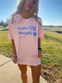 This is a Comfort Colors T-Shirt. The color of the shirt is blossom (light pink), with sky blue lettering. Sizes available as Small-Large. Fit is slightly oversized. Please message me with any questions! Chi Omega Sorority, Little Shirts, Big Little Shirts, Sorority Merch, Sorority Tshirts, Brown Design, Alpha Chi Omega, Alpha Chi, Sorority Outfits