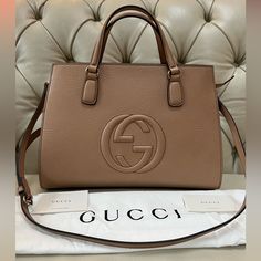 Brand New Gucci Soho Top Handle Satchel Leather Bag With A Long Shoulder Strap And Top Full Zipper, Made In Italy. It Comes With A Dust Bag, Protective Cloth For A Strap And A Pouch As Well As Authenticity Cards. Everything In My Closet Is Authentic And Pm Will Authenticate It For You For Free Dimensions Base Length Is 14” Height 10” Width 6.5” Gucci Shoulder Bag With Logo For Daily Use, Gucci Shoulder Bag With Logo And Top Handle, Gucci Beige Bag With Logo, Elegant Gucci Shoulder Bag With Logo, Gucci Evening Bags With Logo, Luxury Office Bags With Logo, Gucci Handbags Outlet, Gucci Soho, Gucci Handbag