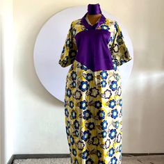 Elevate Your Fashion Sense With This Stunning Ankara Dress That Features An Ethnic Print In Alluring White And Black Colours. The Dress Has A Fabulous Long Length And Bell Sleeves That Add A Touch Of Elegance. It’s Perfect For Any Occasion, Whether It's A Wedding, Party, Cocktail, Casual Or Formal Event. Crafted From Premium Quality Viscose Material And Featuring A Chiffon Fabric Type, This Dress Is Machine Washable, Making It Easy To And Even Comes With Personalisation Options. The Dress Is Han Yellow Batik Print Dresses, Traditional Purple Floral Print Dress, Traditional Floral Print Maxi Dress With Short Sleeves, Traditional Short Sleeve Maxi Dress With Floral Print, Traditional Short Sleeve Floral Maxi Dress, Fitted Yellow Dress With Traditional Patterns, Traditional V-neck Maxi Dress With Batik Print, Traditional Yellow Floral Print Dress, Traditional Yellow Dress With Batik Print