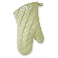 the oven mitt is green and has a white label on it