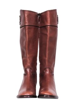 Saddle up in style with Tory Burch's Lowell Tall Riding Boots! Equestrian flair meets city sophistication for a luxe leather boot that's both traditional and timeless. The iconic Tory logo and rich chestnut brown color complete these charming riding boots. The perfect polished partner for midi dresses- giddy up and grab them before they're gone! Size 8 Leather upper & lining Leather & synthetic sole Almond toe Inside zip Stacked block heel Light marks on leather 2 small spots near top of left shoe Heel height 1.5" Shaft height 15.25" Circumference 15.75" Chestnut Brown Color, Brown Leather Riding Boots, Tall Riding Boots, Buy Shoes Online, Chestnut Brown, Leather Riding Boots, Leather Boot, Tory Burch Shoes, Midi Dresses