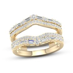 two gold wedding bands with baguets and diamonds