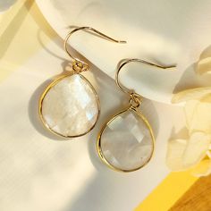 Gold Moonstone Dangle Earrings, June Birthstone Earrings, Natural White Gemstone Earrings, Teardrop Shape, Faceted, Healing Crystal Earring, Bezel Earring, Gold Plated Brass Earring, Natural Quartz Jewlery, Gift for her, gift for him, mother's day gift, mother's earrings. power stone earrings, lucky stone earrings, energy stone earrings Quantity: 1 pair  Material: Cut from Natural Moonstone, gold plated on brass Stone Size: 22mm*21mm approx. Weight: 8~9g Color: Natural stone white colors, gold metal (stone is with different flash) Others: Stones are made of natural moonstone, stone color is natural white and with different flash,  each stone slightly varies in color and stone marks, some have a little bit black dots, small cracks and clouds inside, this is normal, don't affect use. Wire Earring, Bezel Earrings, Birthstone Earrings, Moonstone Earrings, June Birthstone, Birthstone Earring, Wire Earrings, June Birth Stone, Brass Earrings