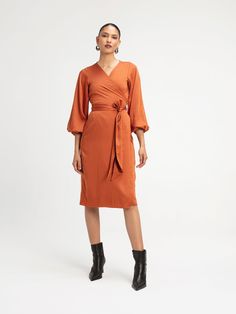 The Lala Midi is a timeless wrap designed with elasticized long sleeves for the perfect balance of style and comfort. This dress is a go-to for any occasion, combining elegance with ease. Wrap dress Elasticized sleeves Midi Length Height customization available 100% Lyocell Satin SIZINGSizes XS to 3XL CAREMachine wash cold with similar colors. Hang dry. Printed Jewelry, Plus Size Pants, Scarf Jewelry, Swimsuit Tops, Midi Length, Jumpsuit Dress, Wrap Dress, The Dress, Rust