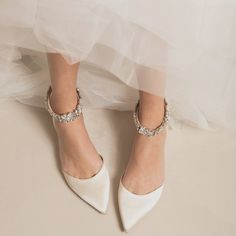 the bride's shoes are all white and there is no image on them yet