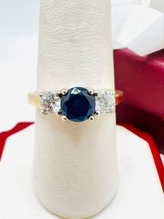 14K Yellow Gold Diamond 0.70ct Blue Sapphire 3 Stone Ring Size 8.25 A perfect gift for your loved one for any special occasion or holiday! Total Ring Weight: 4.62g Ring Length: 26.79mm Ring Width: 22.11mm Gemstone: Diamond Total Diamond: 0.70ct Item will be placed in a gift box. * Blue Sapphire Three Stone Ring With Diamonds, Fine Jewelry Blue Three Stone Jewelry, Fine Jewelry Blue Diamond Ring With Three Stones, Blue Three Stone Diamond Ring, Blue Three Stone Round Jewelry, Blue Three Stone Round Cut Diamond Ring, Blue Diamond Ring With Accents For Anniversary, Blue Sapphire Ring With Diamond Accents For Anniversary, Classic Blue Wedding Ring With Diamond Accents