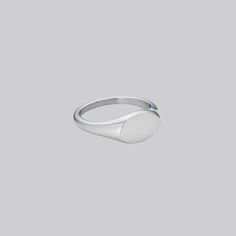 We have designed it to be smaller than a normal signet ring for a minimal and elegant look, yet still retain the classic heirloom appearance. May we suggest it might be a really cute pinky ring? Also available in Gold. Stainless Steel Band Thickness: 2mm-3mm; Oval Width: 11mm; Oval Length:7mm Minimalist Rounded Signet Ring As Gift, Minimalist White Gold Signet Ring For Promise, Minimalist Rounded Signet Ring For Gift, Adjustable Classic Engraved Ring, Simple Everyday Signet Ring With Round Band, Simple Rings With Polished Finish For Promise, Simple Polished Finish Promise Ring, Minimalist Oval Sterling Silver Signet Ring, Simple Sterling Silver Round Signet Ring