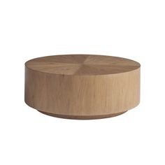 a round wooden table with an unfinished surface on the top and bottom, in front of a white background