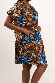 AFRO CHIC: Get your style on in this Ucha Nigerian caftan for women. With a stylish V-neck for a flirty peek of skin, and short sleeves for a serving of chic summer flair. This long dress ensures you stand out wherever you are. CUSTOMIZE THE FIT: We've designed our Ucha dress with a cinch waist elastic ruching to create a beautiful silhouette and give you the freedom to customize the fit to suit your unique shape. Whether you're petite, plus size, or anywhere in between, you'll find a beautifull Bohemian Multicolor V-neck Dress With Short Sleeves, Multicolor Short Sleeve V-neck Dress For Vacation, V-neck Short Sleeve Summer Dress For Vacation, Casual V-neck Dress With Flutter Sleeves For Vacation, Casual Flutter Sleeve V-neck Dress For Vacation, V-neck Short Sleeve Dress For Vacation, Summer V-neck Short Sleeve Dress For Beach, Chic V-neck Short Sleeve Vacation Dress, Chic Short Sleeve Spring Kaftan