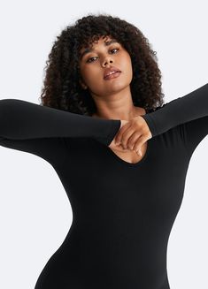 Make a statement with our U-Back Long Sleeve Bodysuit, combining elegance with comfort. The open back adds a polished touch, with the soft, stretchy fabric designed for day-to-night comfort. Stretch V-neck Bodysuit For Workout, Stretch Backless Bodysuit For Loungewear, V-neck Stretch Bodysuit For Workout, Solid Color Backless Bodysuit For Loungewear, Stretch Bodysuit With Lined Body For Loungewear, Stretch Bodysuit With Built-in Bra For Pilates, Sleek Stretch Solid Jumpsuits And Rompers, Stretch Leotard For Loungewear, Stretch Bodysuit With Thumbholes For Yoga