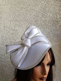 Highest quality white braid hat with rhinestones and veil.  The hat sits on a matching satin headband. Ships immediately expect 4-6 business days Elegant Wedding Hats With Satin Bow, Elegant White Rhinestone Headpieces, Elegant White Hat With Rhinestones, Formal Rhinestone Hats For Kentucky Derby, Elegant Mini Hats With Rhinestones For Weddings, White Fitted Hat With Pinched Crown, White Rhinestone Party Headpiece, Elegant White Adjustable Top Hat, White Fitted Headpiece For Formal Occasions