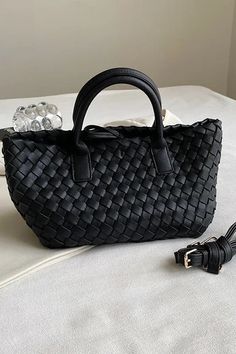 Medium sized vegan leather woven tote. Removable leather shoulder strap and top handles. Classic and timeless style. Shoulder Bag With Double Braided Handles For Errands, Satchel With Braided Handles For Errands, Black Shoulder Bag With Intrecciato Weave And Double Handle, Black Double Handle Shoulder Bag With Intrecciato Weave, Black Intrecciato Weave Shoulder Bag With Double Handle, Double Handle Satchel With Braided Handles For Errands, Chic Bags With Intrecciato Weave For Everyday Use, Black Rectangular Satchel With Intrecciato Weave, Woven Leather Bucket Bag With Double Handle For Errands