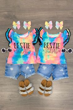 Tie dye top with "Bestie Squad" embossed on the front Ruffle pom pom sleeve details add cute feminine flair Ultra soft material for comfort & ease Perfect for Spring/Summer wear Twinning is winning! Your little one and her BFF will look adorable in our "Bestie Squad" Tie Dye Ruffle Short Sleeve Tops. These short sleeve tops feature pom pom details and "Bestie Squad" embossed on the front. In a versatile tie dye print, this top is made from soft and breathable fabric that will keep her comfy Best Friend Twin Shirts, Playful Tie Dye Tops For Summer, Playful Tie Dye Cotton Tops, Playful Cotton Tie Dye Tops, Playful Cotton Tie-dye Tops, Multicolor Ruffled Tops For Fun Style, Multicolor Fun Tops With Ruffles, Fun Multicolor Tops With Ruffles, Fun Multicolor Ruffled Tops