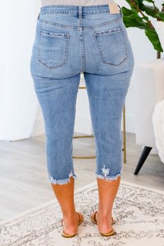 Get ready to turn heads with our Try Harder Capris in blue! These capris feature a button fly and distressed hem, adding a unique touch to your look. So go ahead, and stand out in style! 70% Cotton, 19% Polyester, 9% Rayon, 2% Spandex Stretch Knee-length Cropped Denim Jeans, Denim Blue Knee-length Capris, Medium Wash Denim Capri Cropped Jeans, Medium Wash Cropped Capri Jeans, Medium Wash Denim Cropped Capri Jeans, Medium Wash Cropped Leg Jeans For Day Out, Cropped Leg Medium Wash Jeans For Day Out, Medium Wash Cropped Jeans For Day Out, Knee-length Denim Cropped Jeans For Summer