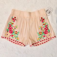 Adorable!! Pink Beige Colored Shorts With Colorful Floral Embroidery And Hem Detail. Made Of Perfectly Light And Gauzy Woven Rayon With A Gathered Waistband And Soft Polyester Lining For Added Comfort. Great For A Sunny Day! Looks Great With Tennis Shoes Or Heals! Pink Bohemian Shorts For Spring, Bohemian Pink Shorts For Spring, Summer Bottoms With Floral Embroidery For Vacation, Summer Vacation Bottoms With Floral Embroidery, Pink Embroidered Cotton Bottoms, Floral Embroidered Bottoms For Summer Vacation, Bohemian Bottoms With Floral Embroidery For Vacation, Pink Bohemian Shorts For The Beach, Embroidered Pink Cotton Bottoms