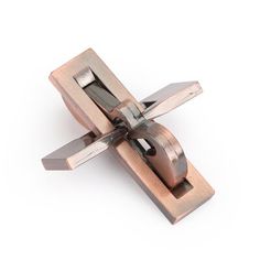 an image of a metal object that is in the shape of a cross on a white background